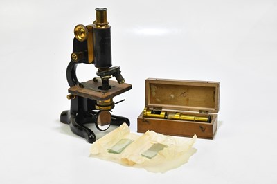 Lot 1467 - A lacquered brass microscope with Beck of...