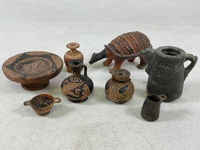 Lot 1140 - A group of pottery including some ancient...