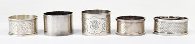 Lot 1111 - Five hallmarked silver napkin rings, various...