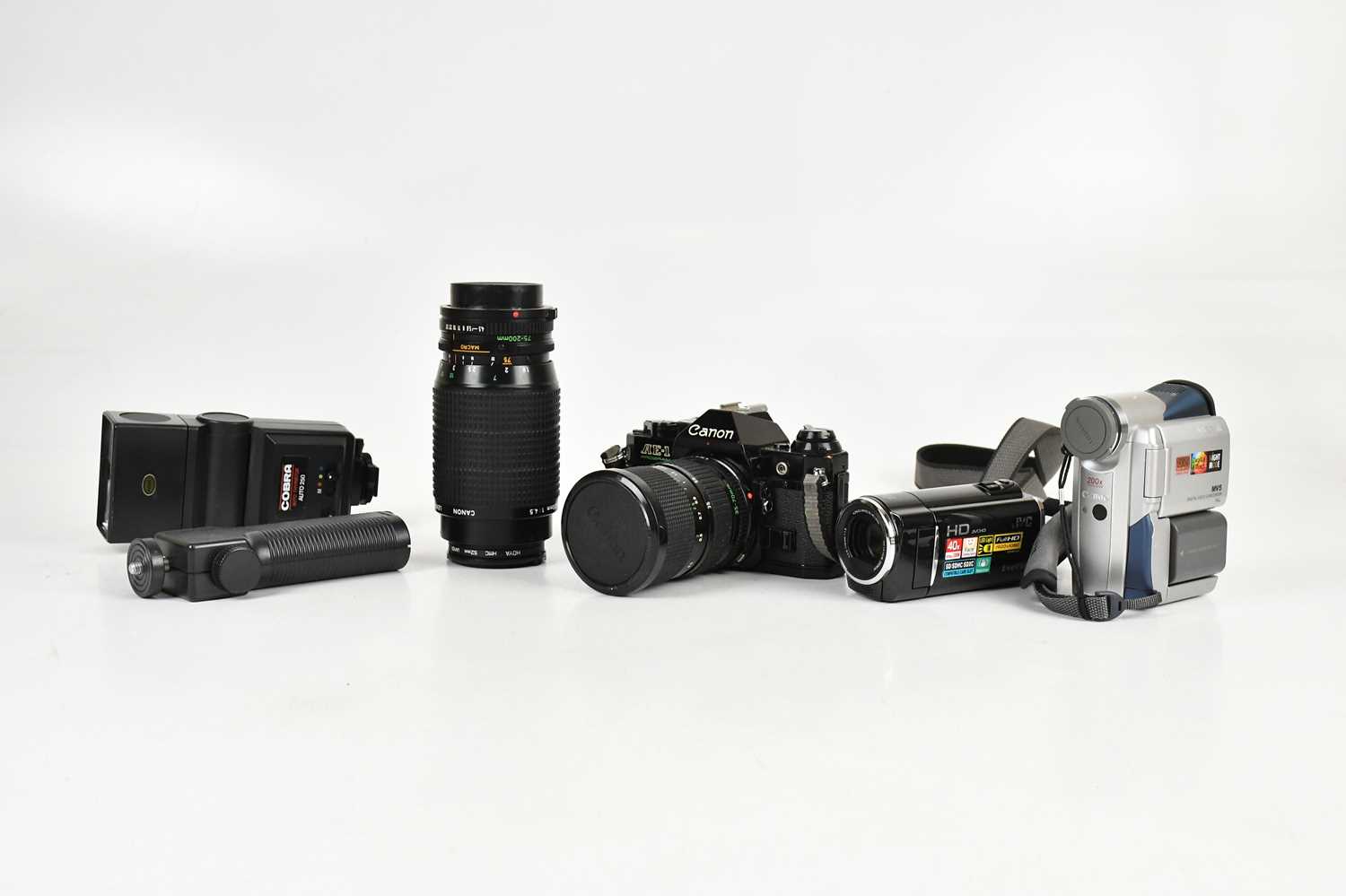 Lot 2484 - CANON; an AE1 35mm film camera with two lenses,...