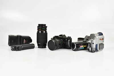 Lot 2484 - CANON; an AE1 35mm film camera with two lenses,...