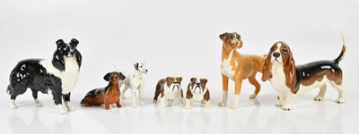 Lot 2488 - BESWICK; a collection of dog models, including...