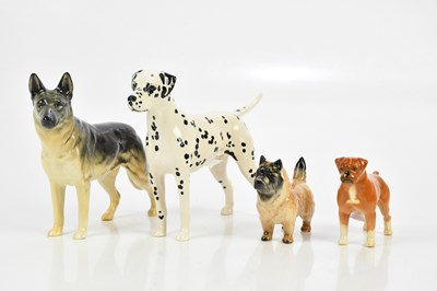 Lot 2530 - BESWICK; four models of dogs, including...