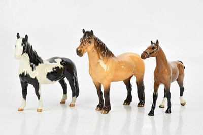 Lot 2495 - BESWICK; three models of ponies comprising...
