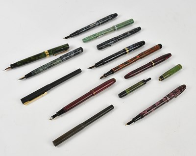 Lot 1387 - A collection of fountain pens and pen casings,...