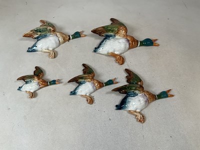 Lot 240 - BESWICK; a set of five wall mounted flying...