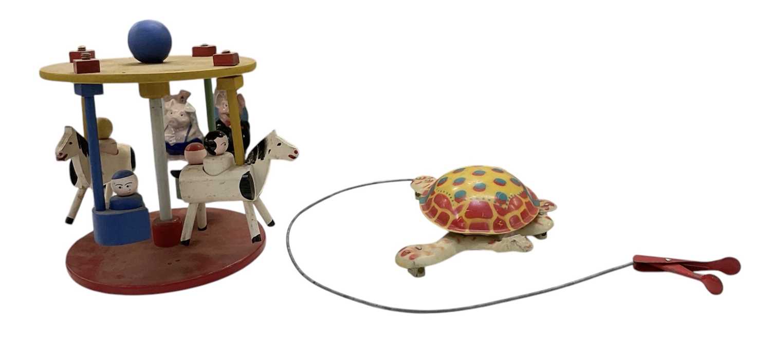 Lot 464 - A 1950s tinplated Mobo 'Toy-Toise' and a...