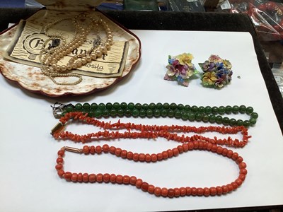 Lot 1127 - A coral beaded necklace with a 9ct rose gold...