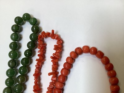 Lot 1127 - A coral beaded necklace with a 9ct rose gold...