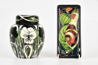 Lot 292 - MOORCROFT; a ginger jar and cover decorated in...