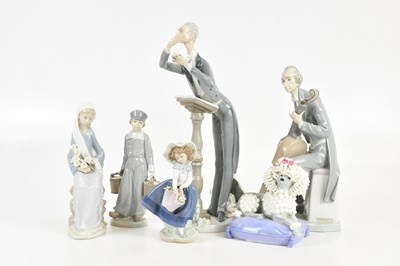 Lot 135 - LLADRO; five ceramic figures including a model...