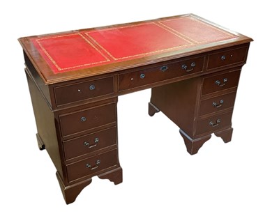 Lot 1111 - A reproduction mahogany twin pedestal knee...