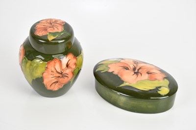 Lot 302 - MOORCROFT; a ginger jar and cover and an oval...
