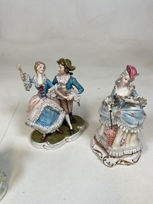 Lot 231 - A group of decorative porcelain figures...