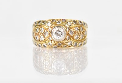 Lot 1288 - An 18ct yellow gold ring set with a central...