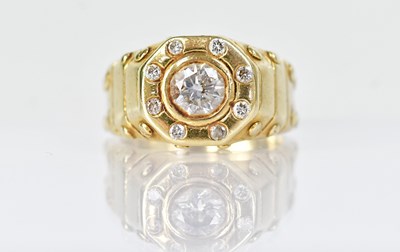 Lot 1301 - An 18ct yellow gold ring set with a central...