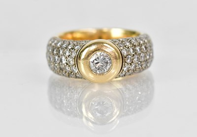 Lot 1287 - An 18ct yellow gold ring set with a central...