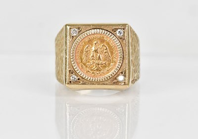 Lot 1331 - A 9ct yellow gold ring set with a Mexican dos...
