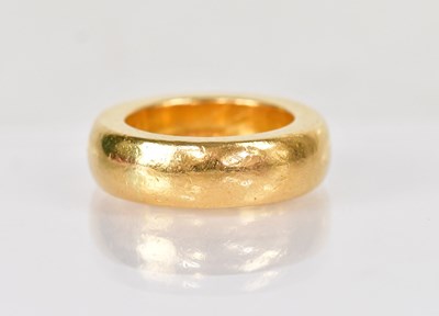 Lot 1259 - A substantial 22ct yellow gold wedding ring,...