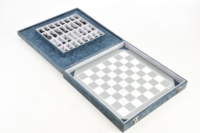 Lot 318 - SWAROVSKI; a boxed chess set and board.