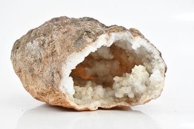 Lot 1526 - MINERAL SPECIMEN; a large snowy quartz geode,...