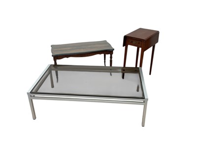 Lot 2245 - A reproduction coffee table, a glass top...
