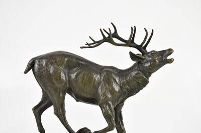 Lot 1409 - AFTER P LECOURTIER; a bronze stag on marble...