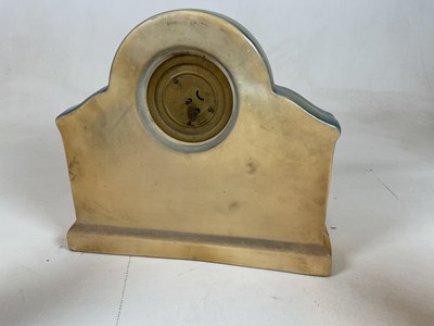 Lot 644 - An Art Deco pottery three piece clock...