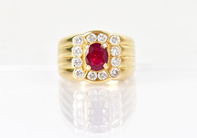 Lot 1289 - An 18ct yellow gold ring set with a central...
