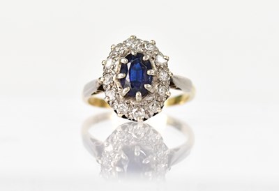 Lot 1357 - A yellow and white metal cluster ring set with...