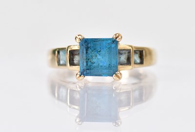 Lot 1311 - A 14ct yellow gold ring set with a square cut...
