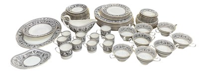Lot 568 - WEDGWOOD; a part ten setting dinner service in...