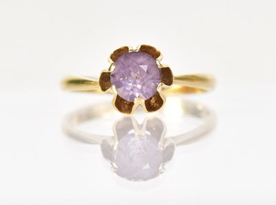 Lot 1273 - An 18ct yellow gold ring set with a central...