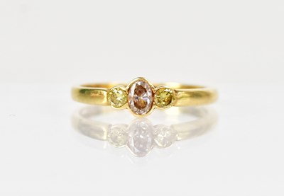 Lot 1282 - An 18ct yellow gold ring set with an oval cut...