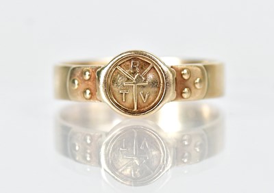 Lot 1313 - A 14ct yellow gold ring inscribed 'RTV', with...