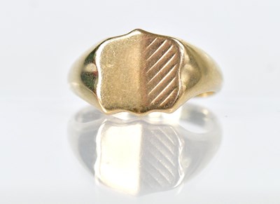 Lot 1327 - A 9ct yellow gold shield-shaped signet ring,...