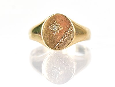 Lot 1328 - A 9ct yellow gold signet ring set with a small...