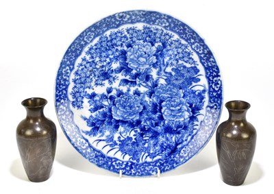 Lot 659 - A Japanese blue and white charger with transfer printed decoration