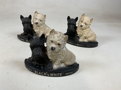 Lot 13 - Three plastic Black & White Whisky West...