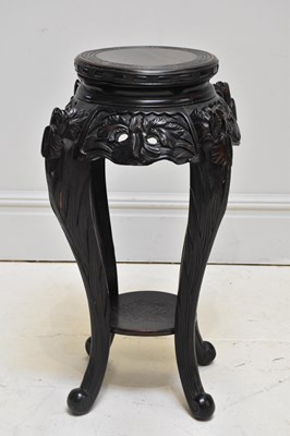 Lot 2338 - A Chinese hardwood carved jardinière stand,...