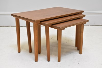 Lot 1033 - A 1970s nest of three tables, largest 39 x 38...