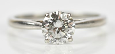 Lot 319 - A platinum diamond set solitaire ring, the...