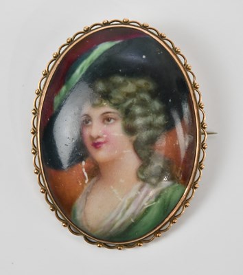 Lot 80 - A yellow metal hand painted ceramic brooch,...