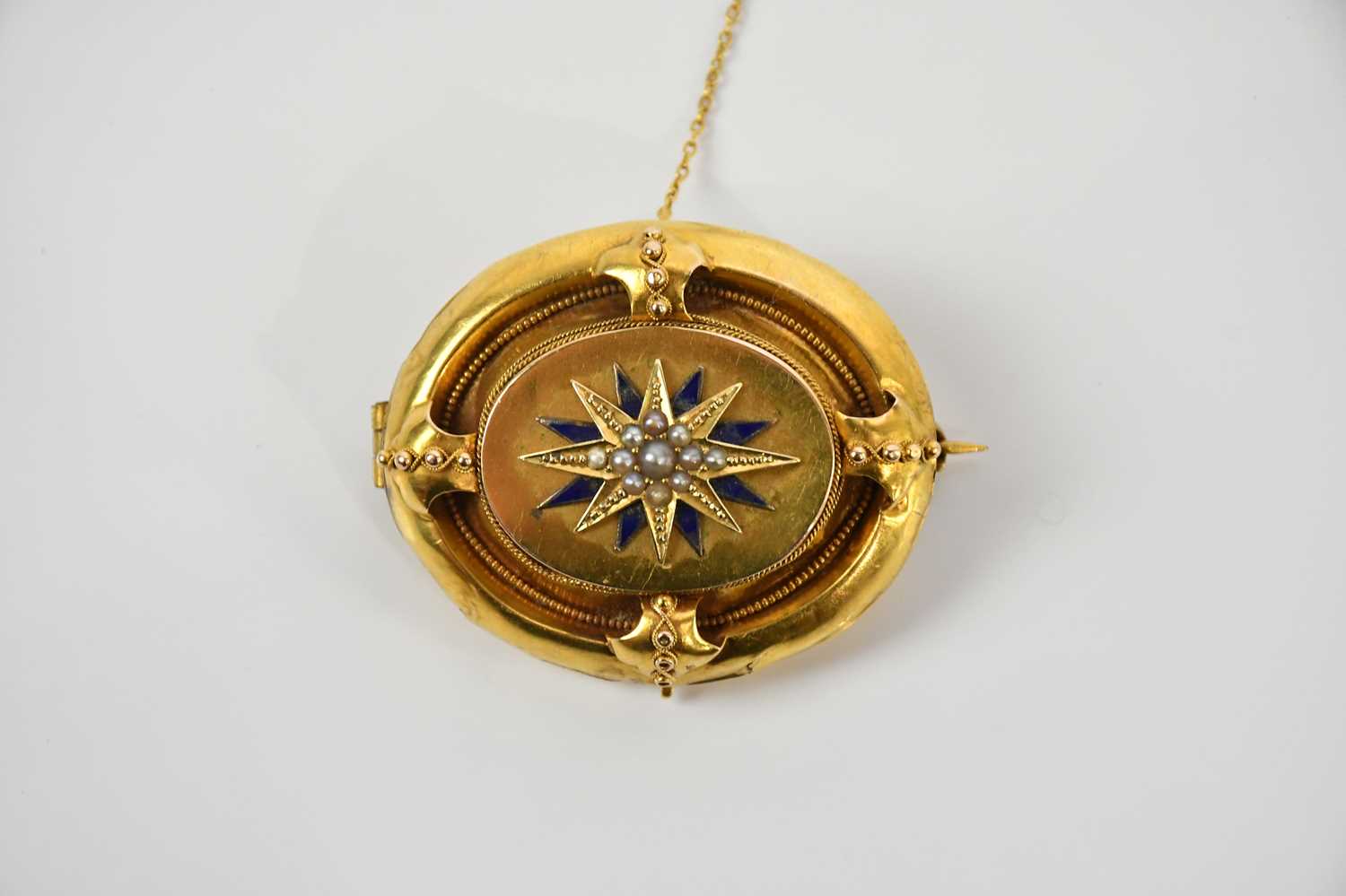 Lot 100 - A Victorian yellow metal seed pearl and blue...