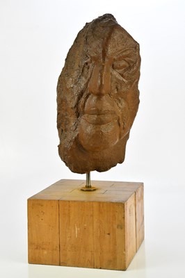 Lot 1607 - An unusual carved stone head, on wooden plinth...
