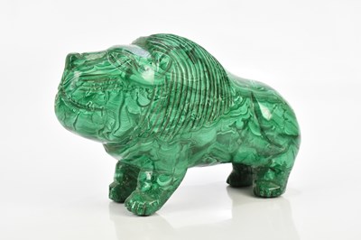 Lot 1385 - A malachite naive carved lion, height approx...