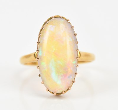 Lot 403 - A yellow metal dress ring set with an oval...
