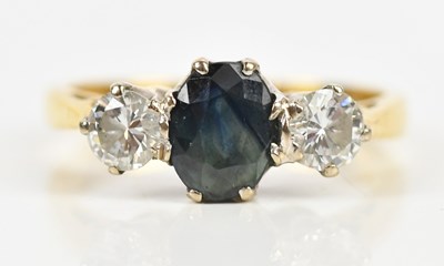 Lot 379 - An 18ct yellow gold diamond and sapphire three...