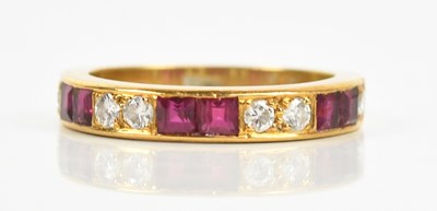 Lot 419 - An 18ct yellow gold diamond and ruby thirteen...