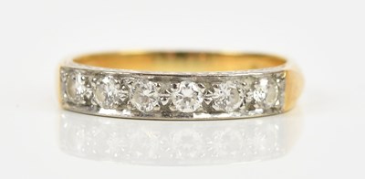 Lot 420 - An 18ct yellow gold six stone half eternity...